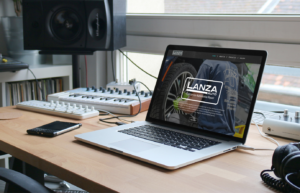 Website mock-up for Lanza Auto on a laptop.